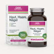 Eine braune Glasflasche und eine Schachtel mit der Aufschrift „Haut, Haare, Nägel Complex (Bio)“ von gse.organic.supplements, ein Nahrungsergänzungsmittel mit B-Vitaminen aus Guave und Basilikumextrakt für Haut, Haare und Nägel. Auf der Verpackung steht, dass es vegan, glutenfrei, laktosefrei und biologisch ist.