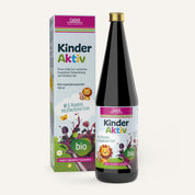 Eine Flasche und eine Schachtel gse.organic.supplements Kinder Aktiv Complex (Bio) Nahrungsergänzungsmittel mit verspielten Frucht- und Löwendesigns, gekennzeichnet als bio, vegan, glutenfrei, laktosefrei und auf Deutsch: B-Vitamin für Kinder & pflanzliches Eisen.