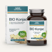 Eine braune Glasflasche und eine Schachtel mit BIO Konjac Glucomannan Sättigungspulver von gse.organic.supplements sind mit grünen Akzenten und Bildern der Konjakwurzel versehen und heben die vegane, gluten- und laktosefreie, biologische Pflanzenfaser hervor.