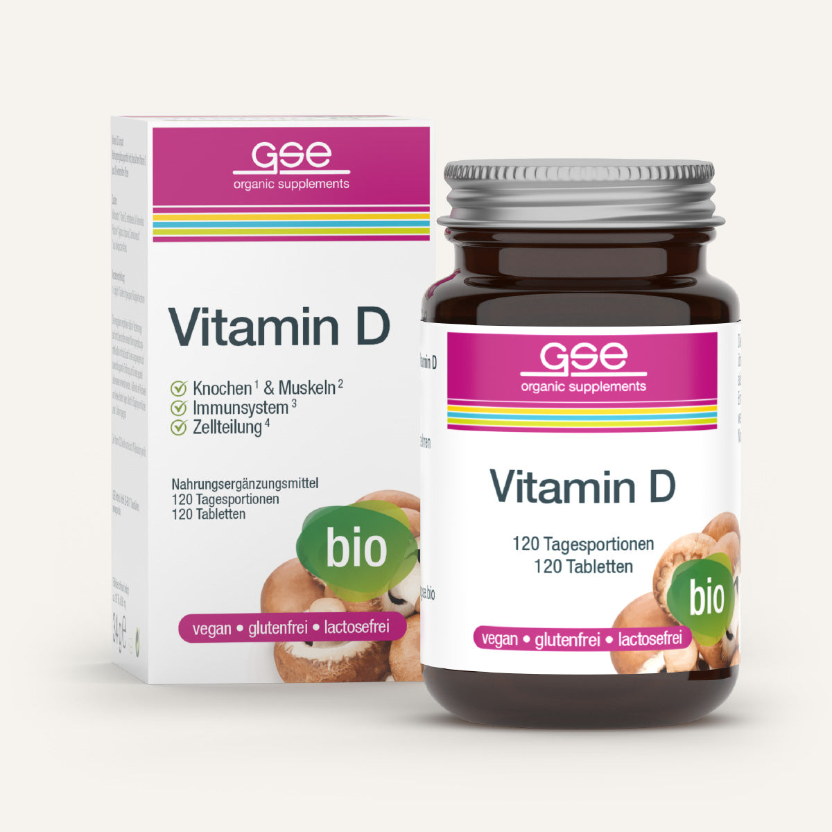 Eine braune Glasflasche und eine Schachtel mit gse.organic.supplements Vitamin D Compact (Bio), einem veganen, gluten- und laktosefreien Bio-Nahrungsergänzungsmittel mit 120 Tabletten zur Unterstützung von Immunsystem, Knochen und Muskeln. Weiß/rosa-grüne Verpackung.
