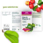 Abgebildet ist eine Dose gse.organic.supplements Zink & Vitamin C (Bio) mit Verpackung, frischen Acerola-Kirschen und grünen Blättern. Das Bio-Produkt unterstützt das Immunsystem und ist vegan, glutenfrei und laktosefrei.