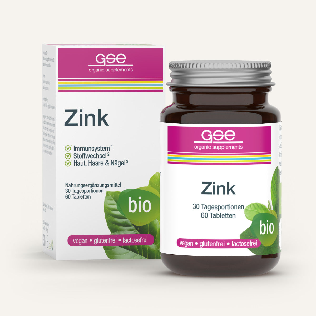 Eine braune Glasflasche und eine Schachtel gse.organic.supplements Zink Compact (Bio) mit der Aufschrift "Zink" und grünen Blättern im Design. Das vegane, gluten- und laktosefreie Produkt unterstützt das Immunsystem.