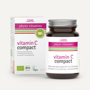 Eine braune Glasflasche und eine Schachtel mit der Aufschrift „Vitamin C Compact (Bio)“ von gse.organic.supplements mit den Logos „Grün“, „Vegan“ und „Bio“. Der deutsche Text hebt Amlaextrakt und Acerolapulver als Hauptbestandteile hervor.
