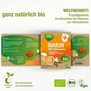 Die Immun NutriGummies (Bio) von gse.organic.supplements kommen in einer grün-orangen, kompostierbaren Verpackung und enthalten vegane Fruchtgummis mit Orangen und Sanddorn sowie Tabletten. Auf dem Etikett wird auf Bio-Zutaten, Vitamin C und die Unterstützung des Immunsystems hingewiesen.